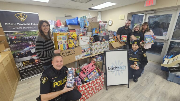 Image of Caledon OPP and BrightStart Caledon Staff in front of toy donations by Caledon Community