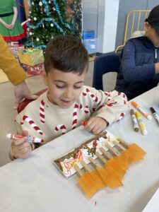 Snowflake Social 2025 Young boy at a table Crafting