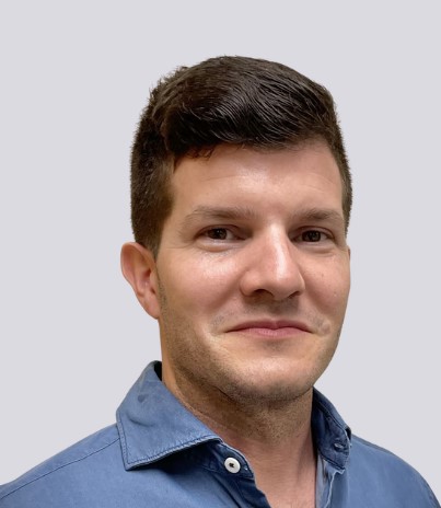 Shawn Ferriera, Board member at BrightStart, smiling in a professional headshot wearing a blue collared shirt.